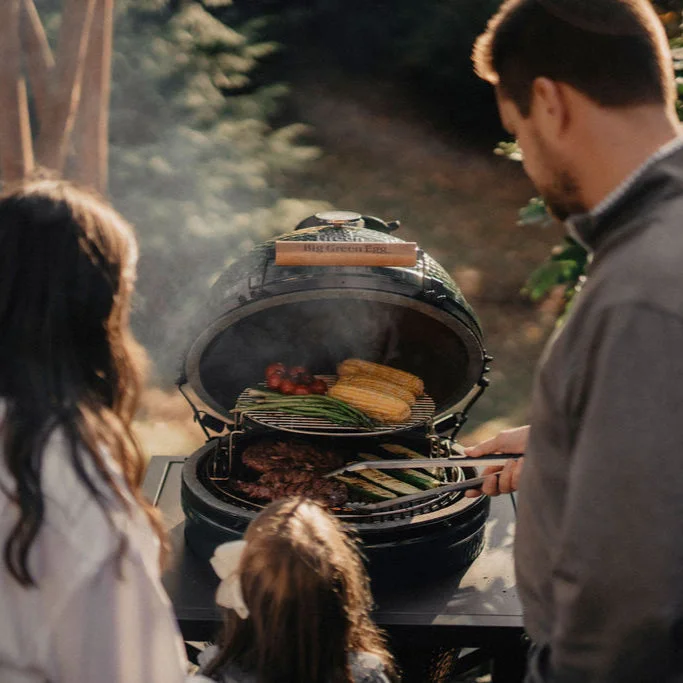 Big Green Egg family grilling outdoors