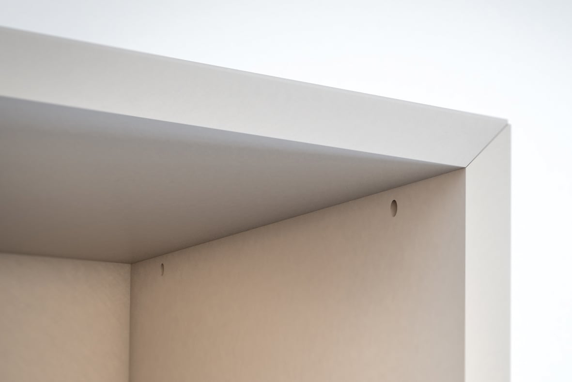 Finished cabinet joint made with Clamex P-14 — only the 6 mm access hole shows